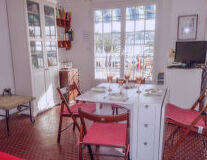 a dining room table in front of a window